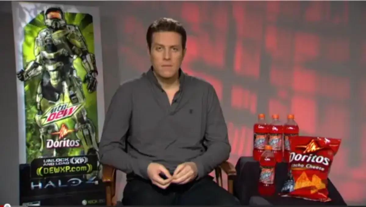 Geoff Keighley sits next to doritos and mountain dew.